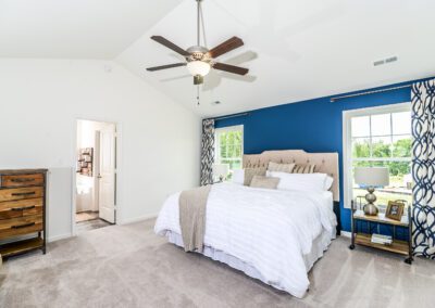 The Osprey primary suite with vaulted ceilings, private bath, walk-in closet